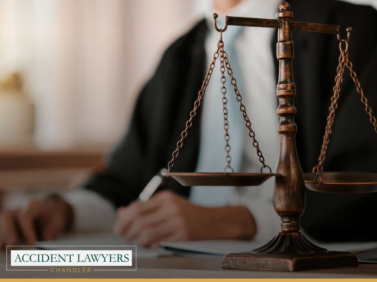 Alt text: "A close-up of a legal professional with scales of justice, representing the work of personal injury attorneys in Chandler, Arizona.